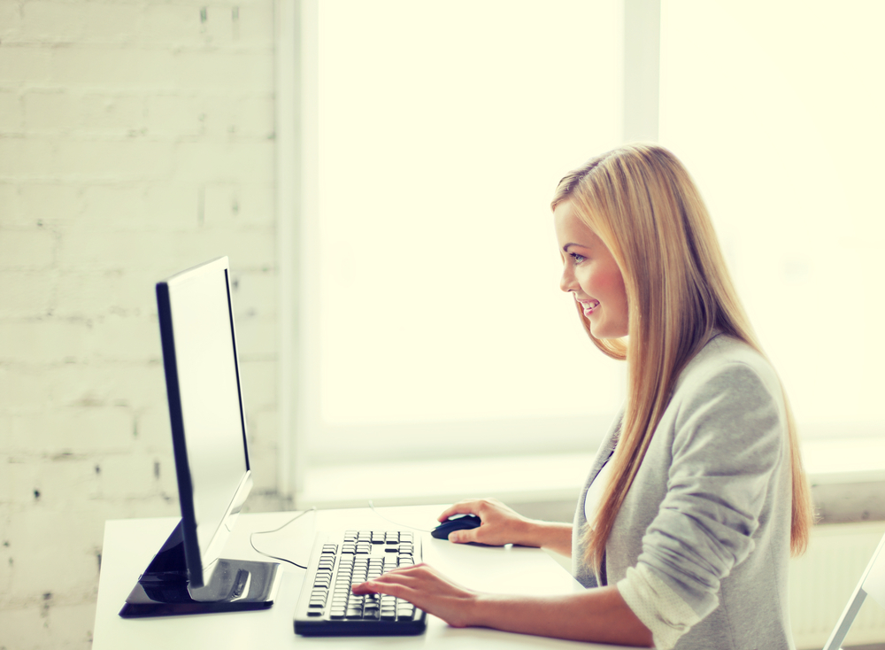 Woman screening tenants on computer